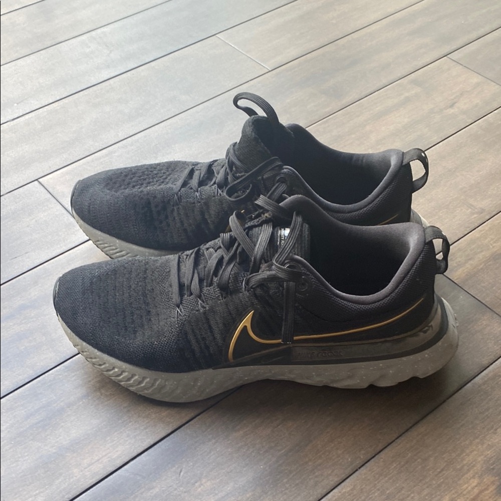Nike React Inifity Flyknit Black and Gold Sneakers with Sleek Design